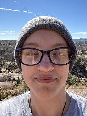 A photo of the portfolio's author, Elissyah Jones, on a hiking trail.